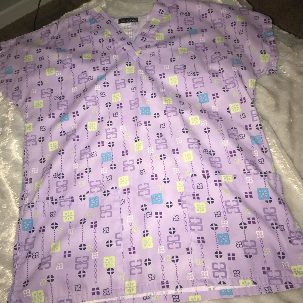 Purple nurses scrub top.